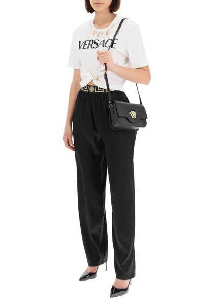 Shop Versace Silk Satin Pajama Trousers With Greca Band In Black,gold