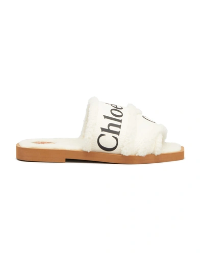 Shop Chloé Woody Shearling Logo Flat Sandals In White