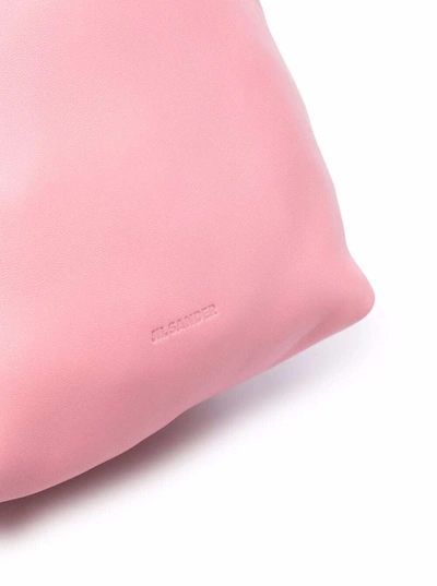 Shop Jil Sander Pink Leather Crossbody Bucket Bag  With Drawstring