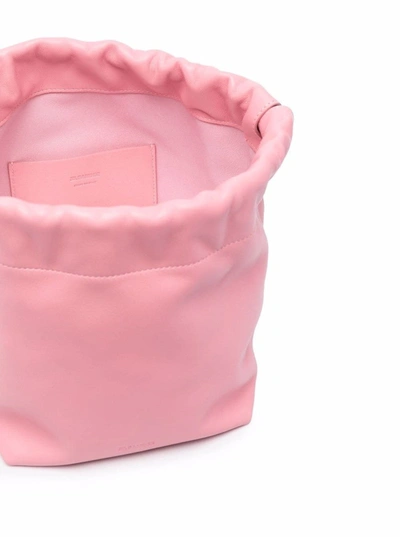 Shop Jil Sander Pink Leather Crossbody Bucket Bag  With Drawstring