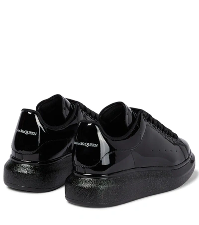 Shop Alexander Mcqueen Oversized Patent Leather Sneakers In 黑色