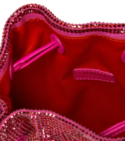 Shop Versace Embellished Suede Clutch In Pink