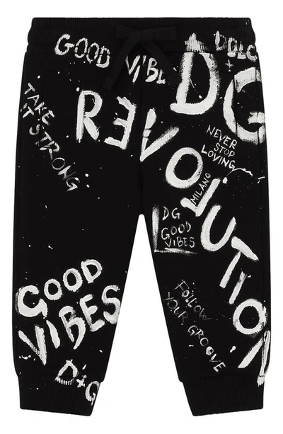 Shop Dolce & Gabbana Revolution Print Joggers In Black