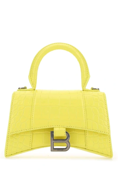 Shop Balenciaga Hourglass Xs Top Handle Bag In Yellow