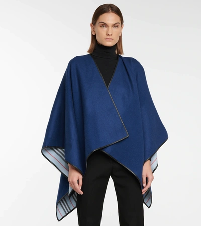 Shop Burberry Icon Stripe Wool Cape In Blue