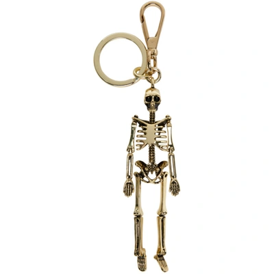 Shop Alexander Mcqueen Gold Skeleton Keychain In 7050 Gold