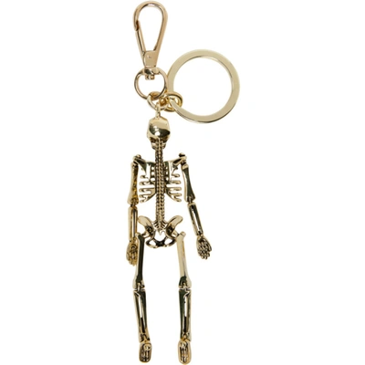 Shop Alexander Mcqueen Gold Skeleton Keychain In 7050 Gold