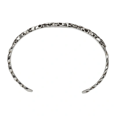 Shop Alexander Mcqueen Silver Multi Skull Cuff Bracelet In 0446 Mcq0911sil.v.b