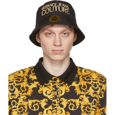 Shop Versace Jeans Couture Black & Gold Logo Bucket Hat In Em27 Blkgld