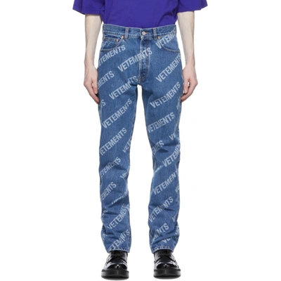 Shop Vetements Blue Denim All Over Logo Jeans In Blue 14620078
