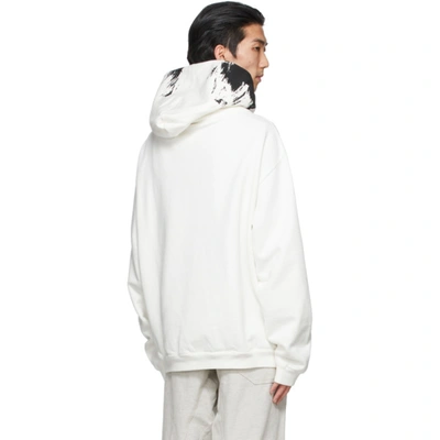 Shop Maison Margiela White Logo Paint Hoodie In 101 Offwhit