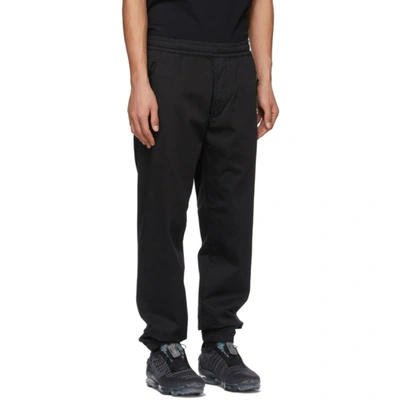 Shop Stone Island Black Ghost Trousers In V0029 Black