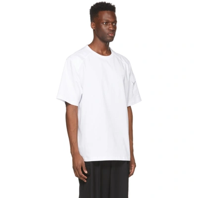 Shop Juunj White Logo Sleeve-pocket T-shirt In 1 White