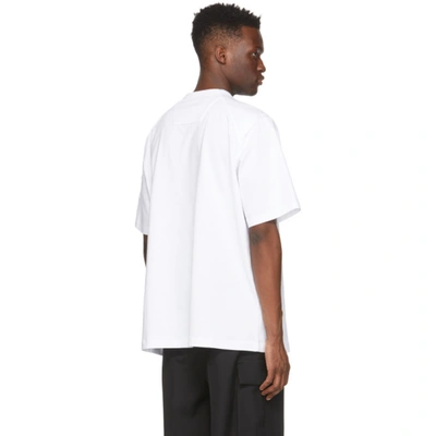 Shop Juunj White Logo Sleeve-pocket T-shirt In 1 White