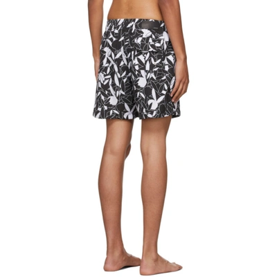 Shop Amiri Black & White Playboy Edition All Over Swim Shorts In Black-poly Spandex