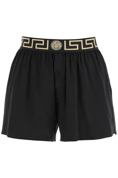 Shop Versace Silk Satin Shorts With Greca In Black,gold