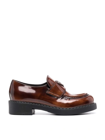Shop Prada Logo-plaque Brushed-effect Loafers In Brown