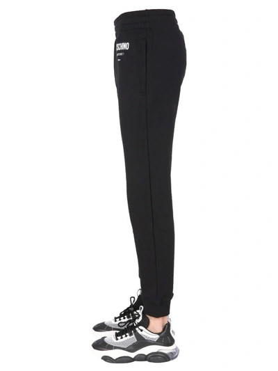 Shop Moschino Jogging Pants With Logo Print In Black