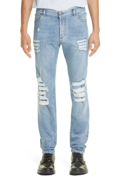 Shop Balmain Monogram Distressed Tapered Jeans In Blue