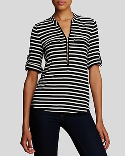 Shop Calvin Klein Striped Zip Front Roll Sleeve Knit Blouse In Black/birch