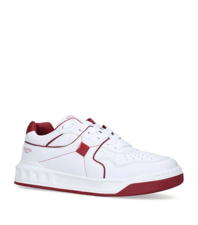 Shop Valentino Garavani Roman Stud Sneakers In White