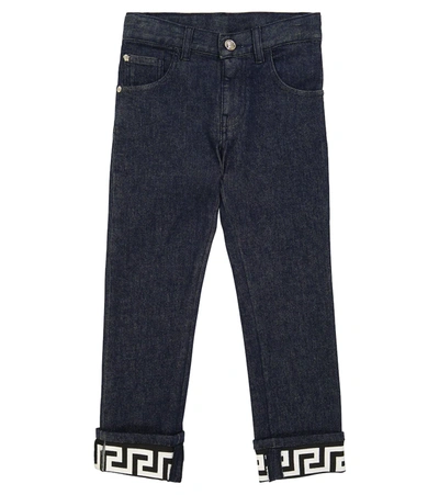 Shop Versace Greca Stretch-cotton Jeans In 蓝色