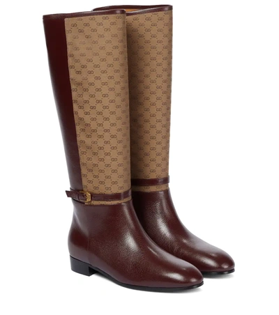 Shop Gucci Gg Leather Knee-high Boots In 棕色