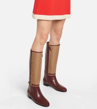 Shop Gucci Gg Leather Knee-high Boots In 棕色