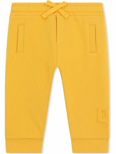 Shop Dolce & Gabbana Logo-embossed Track Pants In Yellow