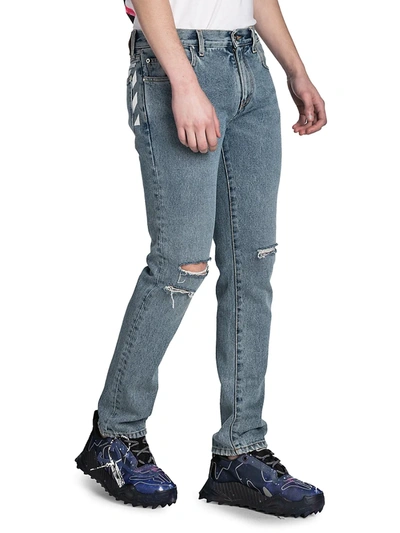 Shop Off-white Distressed Skinny Jeans In Bleach Indigo