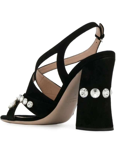 Shop Miu Miu Crystal Embellished Sandals In Nero