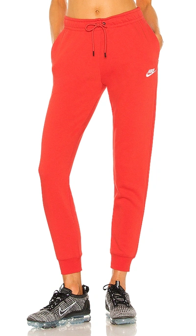 Shop Nike Nsw Essential Fleece Pant In Chili Red
