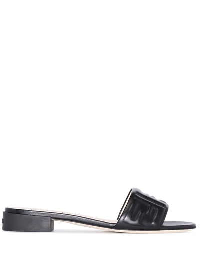 Shop Fendi Embossed Ff-motif Slip-on Sandals In 黑色