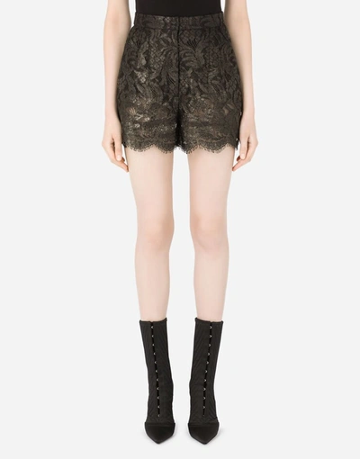 Shop Dolce & Gabbana Laminated Lace Shorts In Black