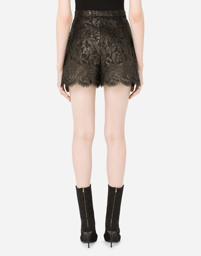 Shop Dolce & Gabbana Laminated Lace Shorts In Black