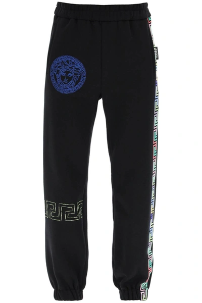 Shop Versace Greca Logo Printed Sweatpants In Black