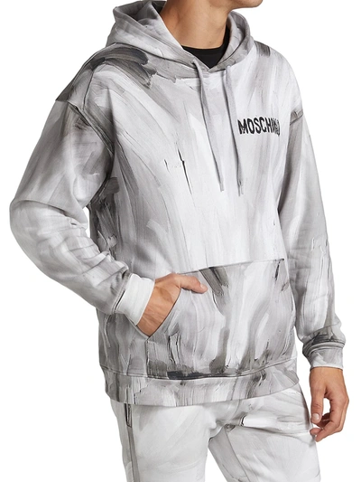 Shop Moschino Painted Logo Hoodie In Neutral