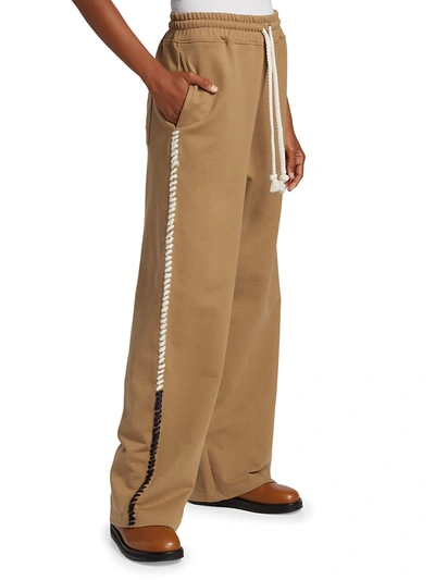 Shop Jw Anderson Contrast Stitch Track Pants In Tobacco