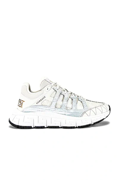 Shop Versace Trigreca Sneaker In White & Gold