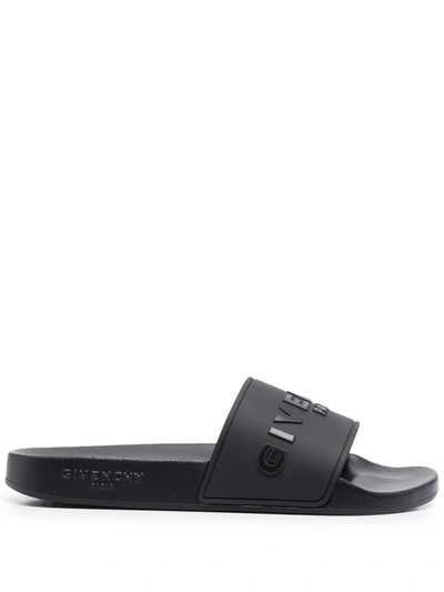 Shop Givenchy Embossed-logo Slides In Schwarz