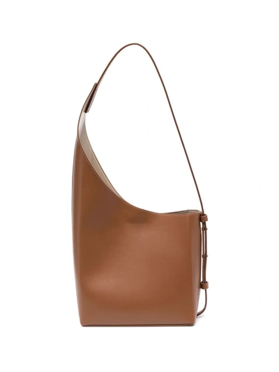Shop Aesther Ekme Demi Lune Asymmetric Shoulder Bag In Brown