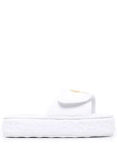 Shop Versace Embossed Logo Platform Slides In White