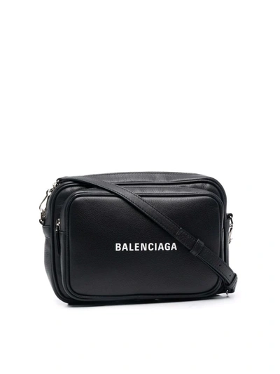 Shop Balenciaga Logo-print Leather Messenger Bag In Black