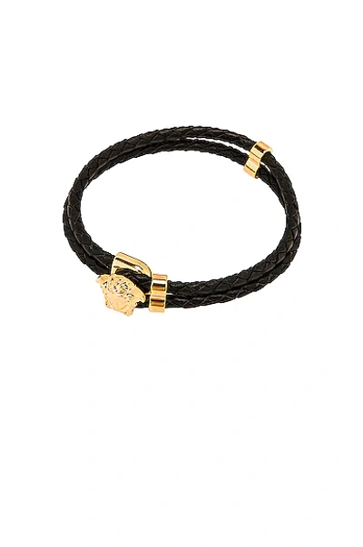 Shop Versace Bracelet In Black & Gold