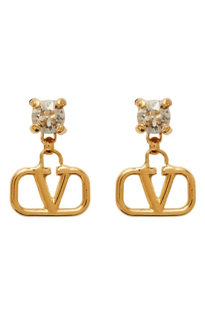 Shop Valentino Crystal Logo Drop Earrings In Crystal Gold