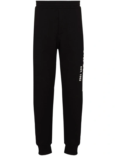 Shop Alexander Mcqueen Logo Graffiti Print Track Pants In Schwarz