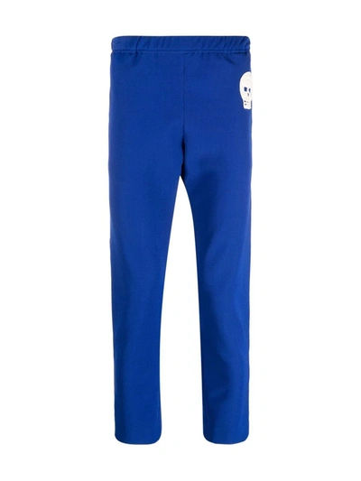 Shop Alexander Mcqueen Skull-patch Slim-fit Track Pants In Blue