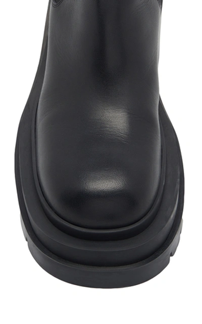 Shop Bottega Veneta The Lug Leather Ankle Boots In Black