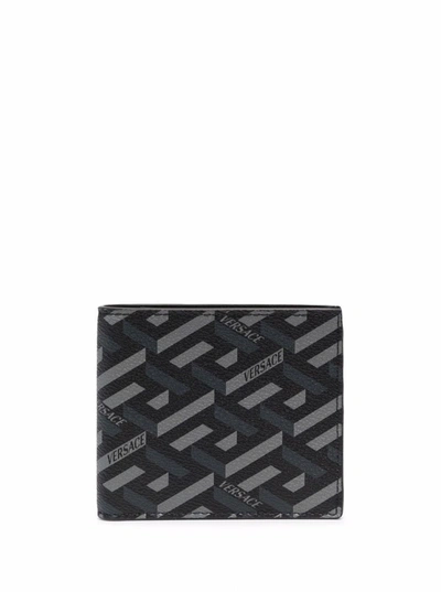 Shop Versace Bifold Monogram Leather Wallet In Black