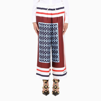 Shop Valentino Printed Silk Cropped Trousers In ["blue"/ "red"/ "white"]
